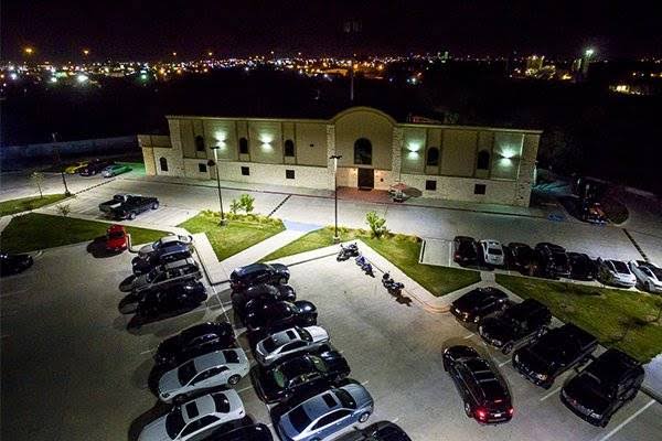 Aerial nighttime view of Bucks Cabaret El Paso and its illuminated parking lot